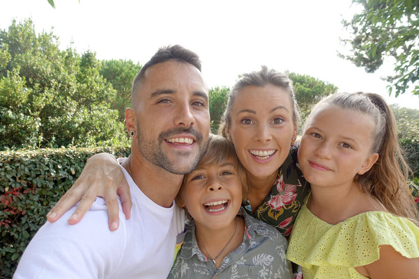 Portrait of cheerful family on summer vacation - Photo, Image