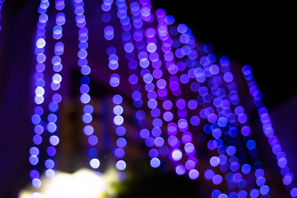 Light abstract bokeh background by blur or defocused at light element use for background or wallpaper in new year diwali christmas marriage celebration - Foto, Imagem