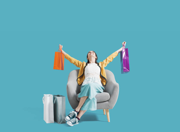 Cheerful shopaholic woman with shopping bags - Foto, imagen