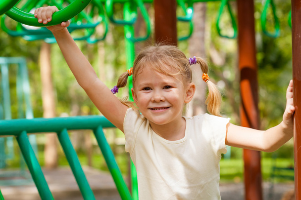 The girl on the playground - Фото, зображення