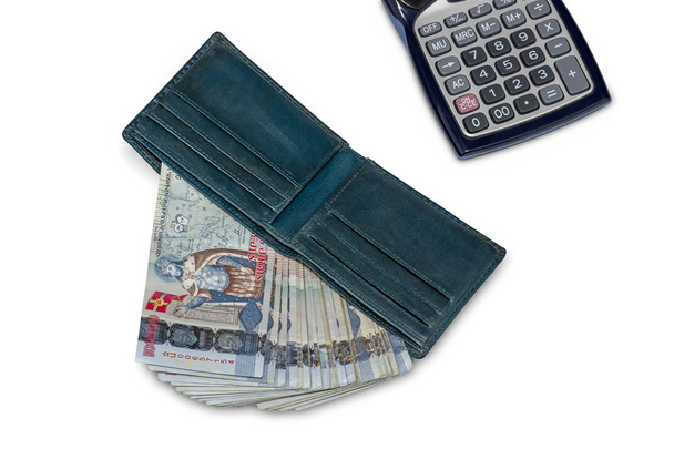 Blue leather wallet with Armenian Dram in AMD 100,000 banknotes together with calculator isolated on white background. Business and finance concept. Flat lay composition - Photo, Image