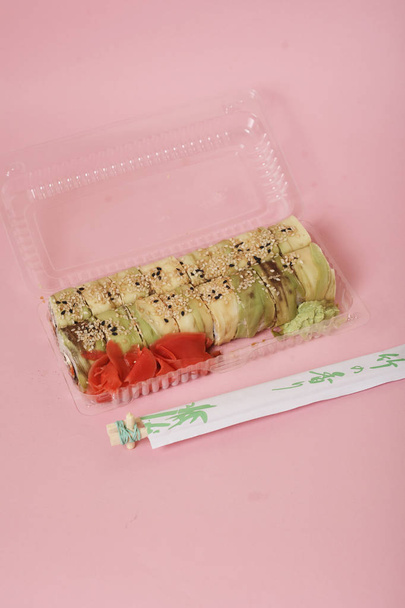 japanese sushi and rolls on pink background - Fotografie, Obrázek