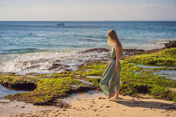 Young woman tourist on Pantai Tegal Wangi Beach, Bali Island, Indonesia. Bali Travel Concept - Photo, image