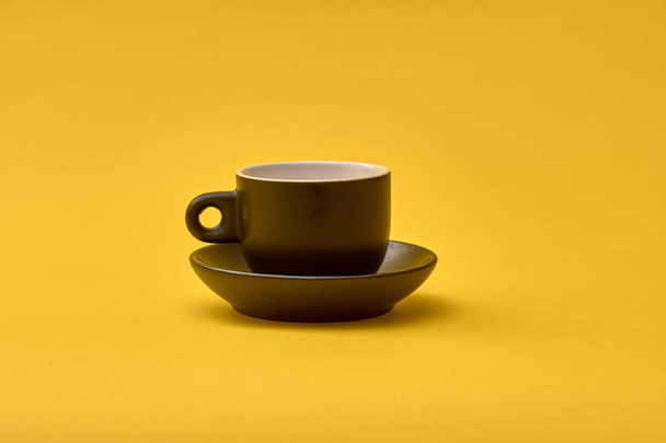 Empty Coffee mug on yellow background. - Foto, Imagem