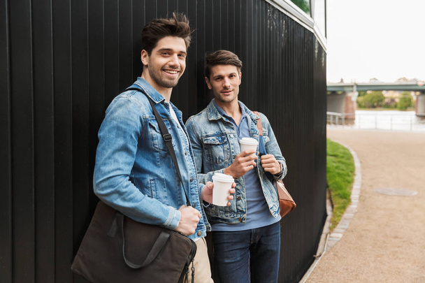 Two smiling young men friends dressed casually - Photo, Image