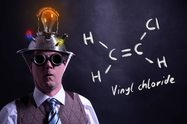 Nerd presenting handdrawn chemical formula of vinyl chloride - Photo, Image