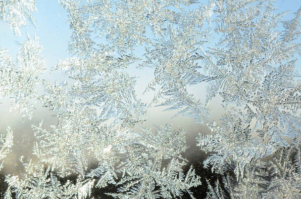Snowflakes frost rime macro on window glass pane - Photo, Image