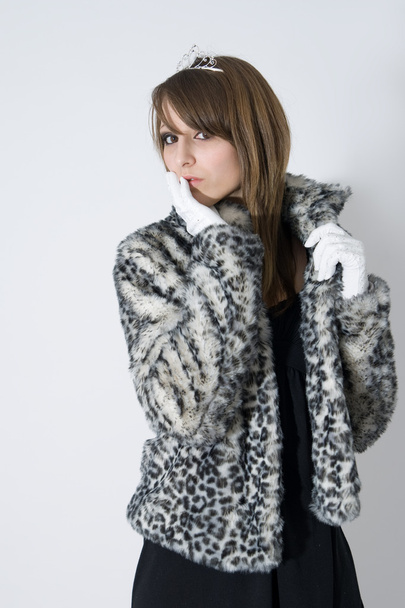 Fashionable teenager girl in fur coat - Фото, изображение