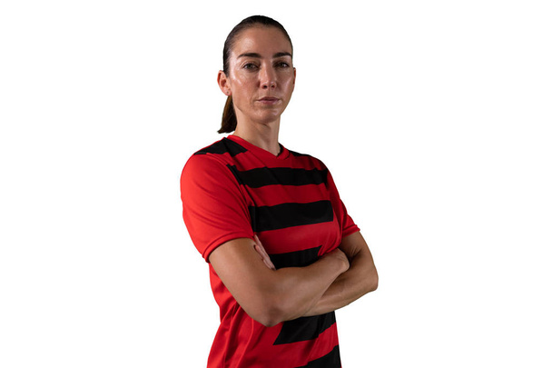 Tough female soccer player isolated on white background - 写真・画像