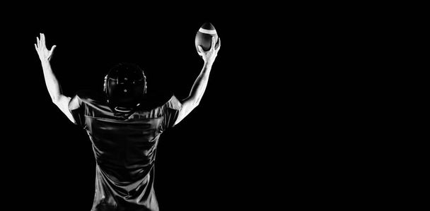 American Football Player isolated on black background  - 写真・画像
