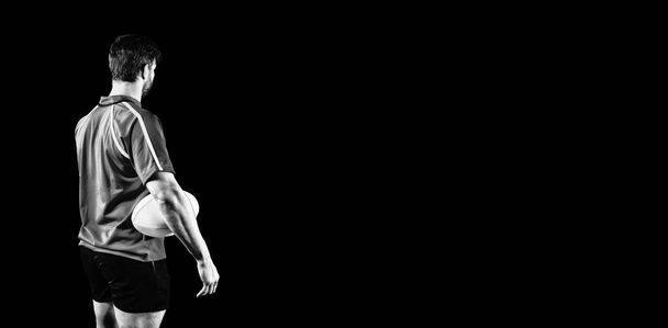 Tough Rugby Player isolated on black background - 写真・画像