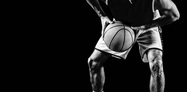 Basketball player isolated on black background  - Fotografie, Obrázek