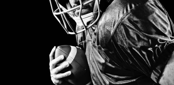 American Football Player isolated on black background - Фото, изображение