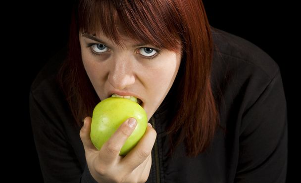 Girl eating delicious green apple - Photo, image