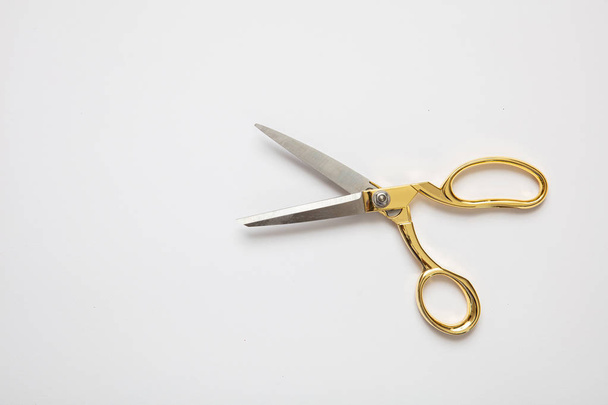 Scissors gold and silver isolated against white background - Foto, immagini