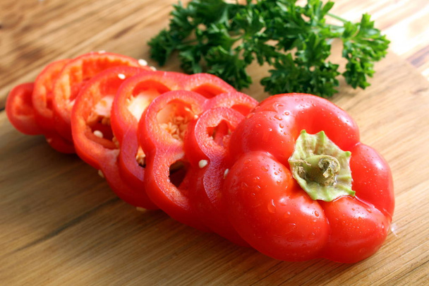 chopped red pepper lies on a cutting board - Foto, immagini