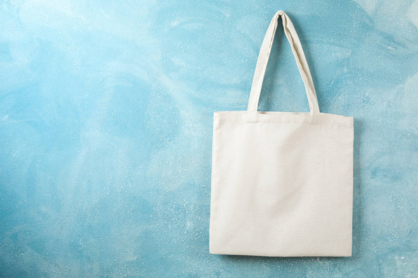 Tote cotton bag on color wall, space for text - Foto, afbeelding