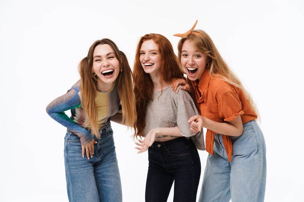 Portrait of three cheerful girls wearing casual clothes laughing - Foto, immagini