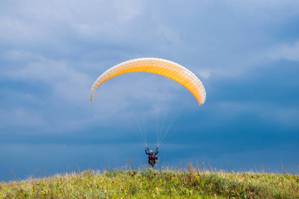 view of people paragliding at mountains of Ushkonir, Tian-Shan, Kazakhstan - Photo, Image