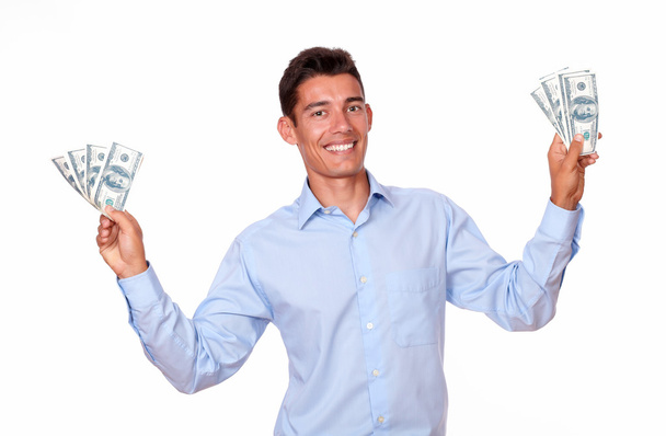 Fashionable man standing and holding cash - Foto, afbeelding