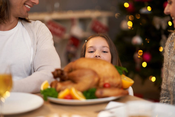 Beautiful family eating Christmas dinner at home - Fotografie, Obrázek