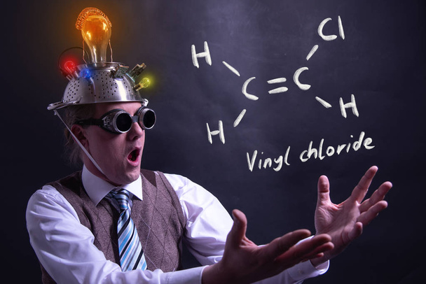 Nerd presenting handdrawn chemical formula of vinyl chloride - Photo, Image