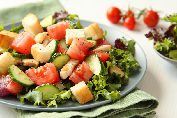Salad with meat, cucumbers, tomatoes and croutons - Photo, Image