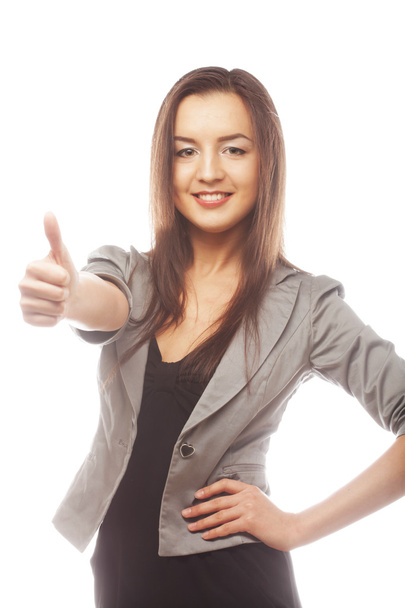 Attractive business woman giving thumbs up - Foto, imagen