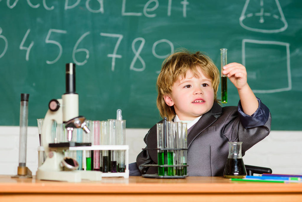 Inspiration for investigations. Kid study biology chemistry. Boy microscope and test tubes school. Basic knowledge primary school education. Educational experiment. Knowledge concept. Knowledge day - Photo, Image