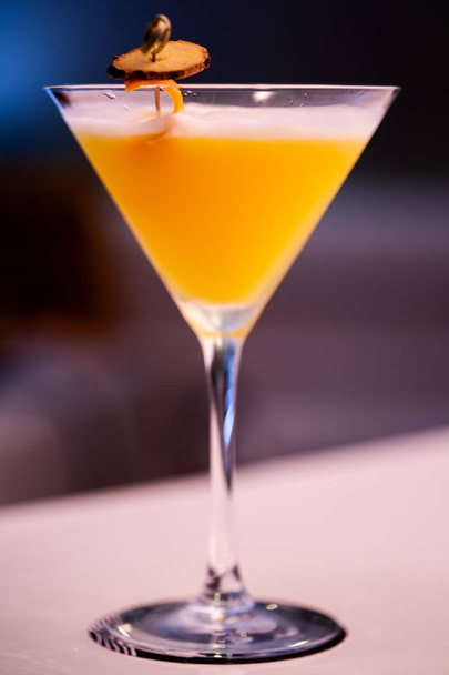 Beautiful orange cocktail on the bar counter. - Foto, imagen