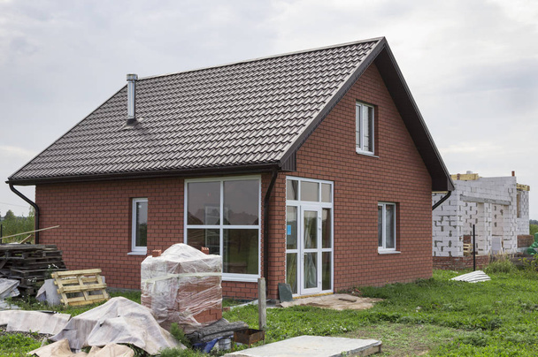 Small house is finished with decorative bricks - Foto, imagen