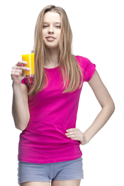 Young beautiful blond woman drinking orange juice - Zdjęcie, obraz