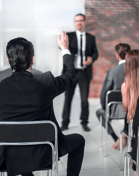 businessman answering questions from employees at a business meeting - Photo, image