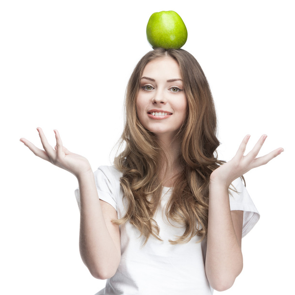 Young beautiful brunette woman with green apple - Photo, Image