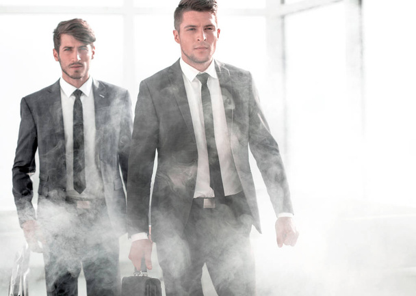 business people in a smoky office - Foto, Bild