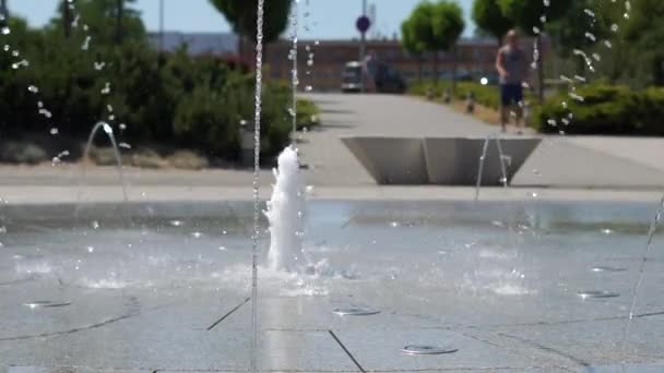 The fountain in the square beats from under concrete slabs. - Footage, Video