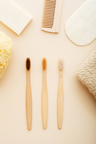Zero waste and plastic free concept with bamboo tooth brush, towel, sea sponge, loofah, soap, wooden hair brush. Eco-friendly bathroom. Natural products. - Foto, Imagem