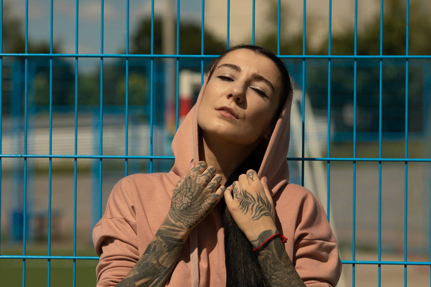portrait of young attractive woman with tattoos looking at camera. - Fotoğraf, Görsel