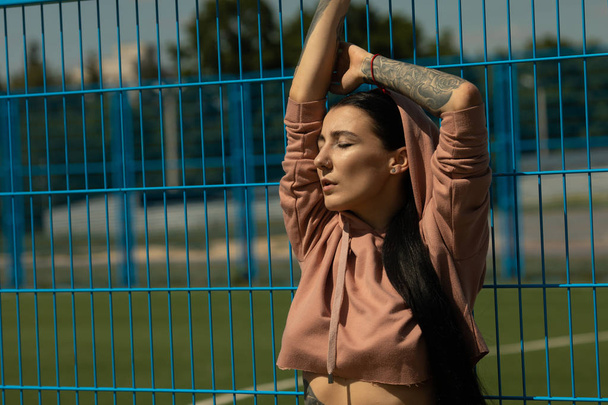 portrait of young attractive woman with tattoos looking at camera. - Foto, afbeelding