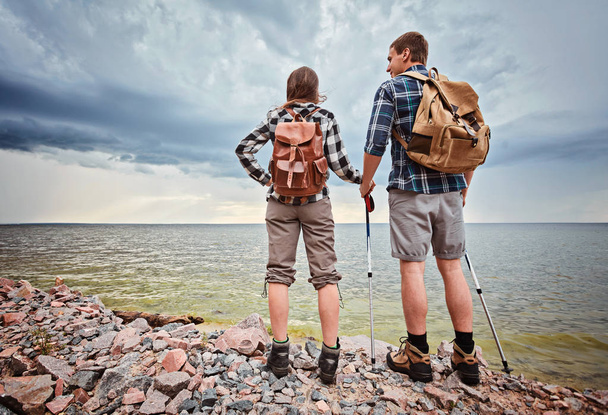 Couple tourists with backpacks outdoors. - Photo, Image