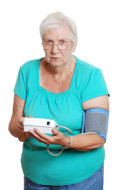 Senior woman unhappy using automatic blo - Zdjęcie, obraz