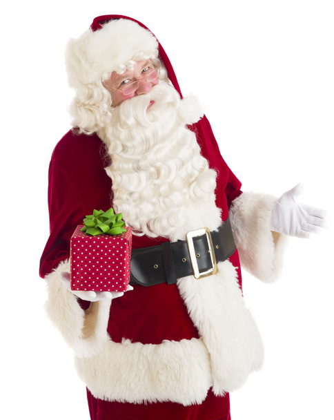 Santa Claus Gesturing While Holding Gift Box - 写真・画像