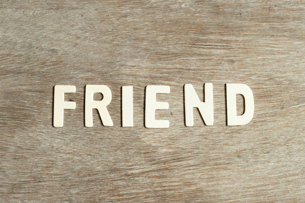 Alphabet letter in word firend on wood background - Photo, Image