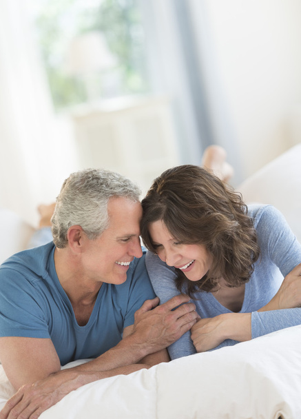 Romantic Couple Smiling In Bed - Photo, image