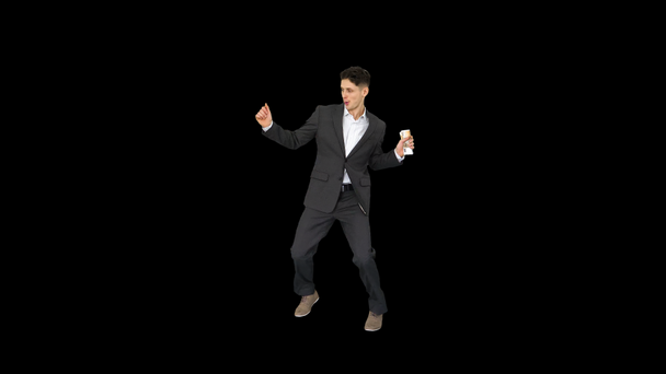 Young happy businessman dancing after counting salary Win dance, Alpha Channel - Footage, Video
