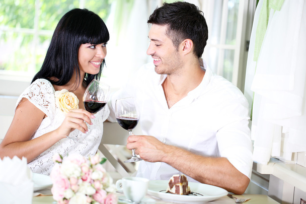 Beautiful couple having romantic dinner at restaurant - Фото, зображення