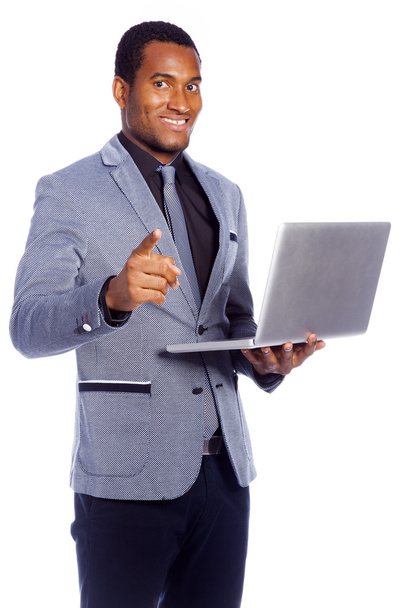 Portrait of a smiling business man holding a laptop - 写真・画像