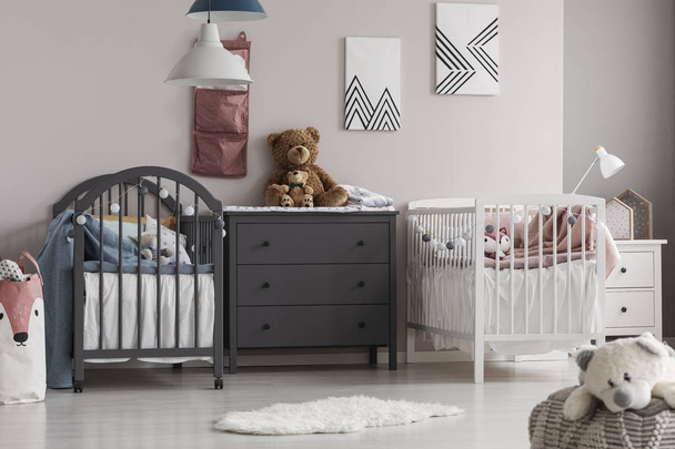 Grey wooden commode in the middle of cute baby room for twins - Fotografie, Obrázek