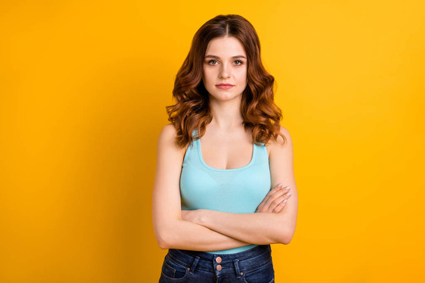 Photo of gorgeous cute charming attractive nice pretty sweet lovely girlfriend standing with her hands folded wearing turquoise tank-top isolated with bright color background - Photo, image