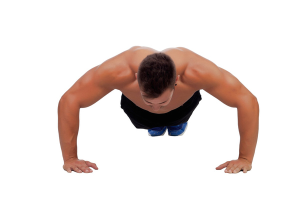 Muscular man doing pushups - Фото, зображення